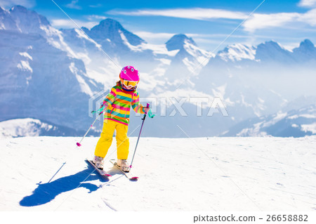 Ski and snow fun. Child in winter mountains. 26658882