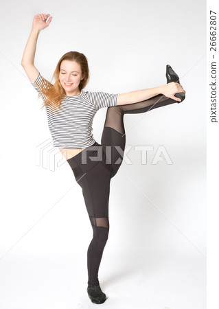 stretching leg muscles with standing one leg up. 26662807