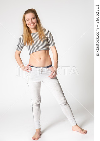 girl stands legs apart and hands on the waist girl stands legs apart and hands on the waist 26662811