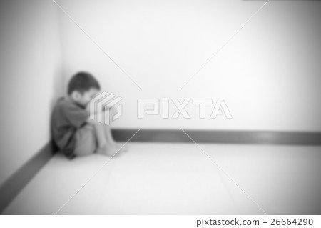 Blurred of the boy hugged her knees 26664290