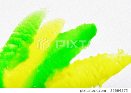 Green and yellow stripes of plasticine spread in a Green and yellow stripes of plasticine spread in a 26664375