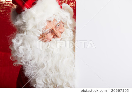 Santa Claus pointing in blank advertisement banner Santa Claus pointing in blank advertisement banner 26667305