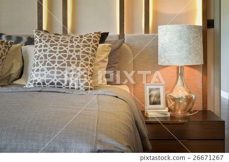 luxury bedroom with white lamp on wooden table 26671267
