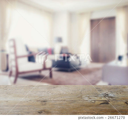 wooden table top with blur of modern living room wooden table top with blur of modern living room 26671270
