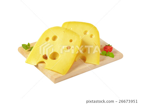 wedges of yellow cheese with eyes 26673951