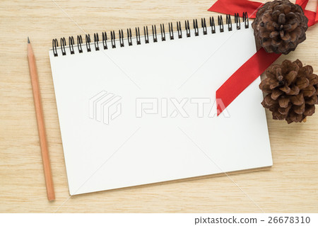 Top view of notebook on wooden background 26678310