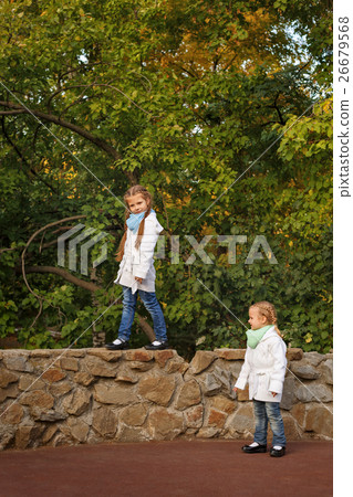 Sisters in autumn park. Sisters in autumn park. 26679568