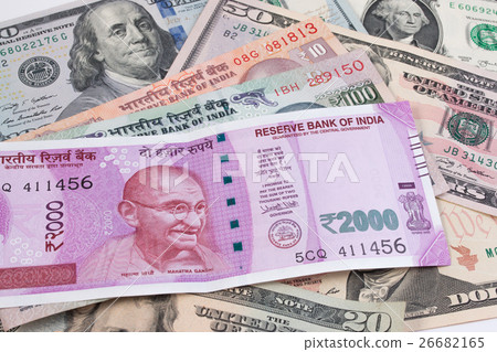 2000 rupee banknote over US dollar banknote. 2000 rupee banknote over US dollar banknote. 26682165