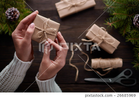 Beautiful female hands are packed Christmas gift Beautiful female hands are packed Christmas gift 26685969