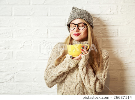 Winter Hipster Girl Enjoying a Cup of Hot Tea Winter Hipster Girl Enjoying a Cup of Hot Tea 26687114