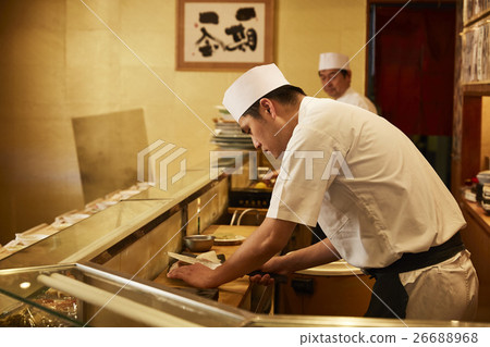 A sushi shop in front 26688968