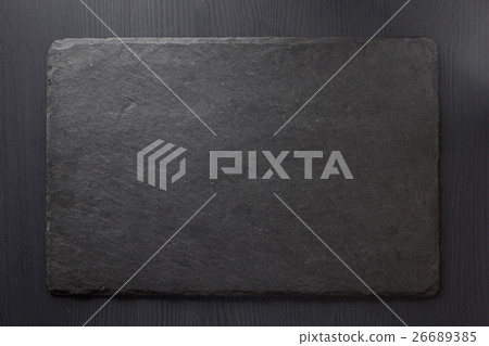 black slate stone on wooden 26689385