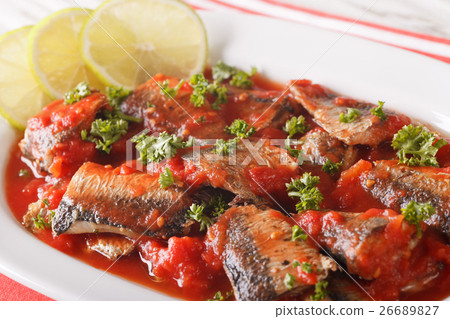 sardines in tomato sauce, decorated with lime 26689827
