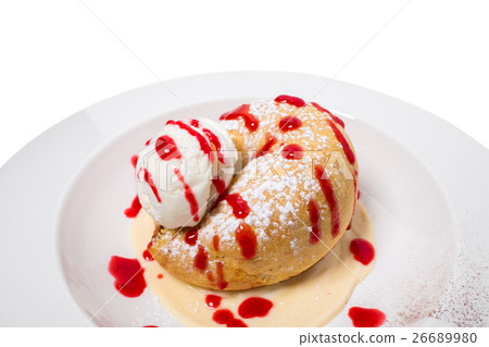 Cinnamon bun with ice cream. 26689980
