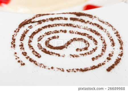 Cinnamon powder on a plate. 26689988