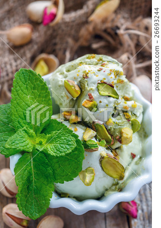 Homemade ice cream with pistachios and mint. Homemade ice cream with pistachios and mint. 26693244