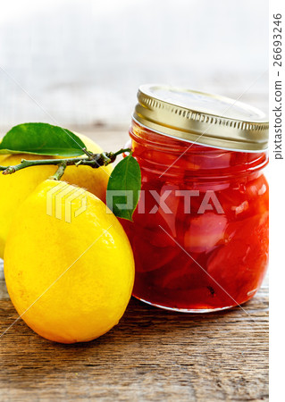 Glass jar of jam of quince and lemon. 26693246