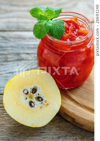 Quince jam in a glass jar. Quince jam in a glass jar. 26693248