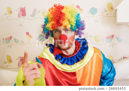 Clown in funny costume show finger. Clown in funny costume show finger. 26693455