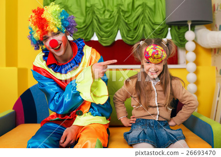 图库照片: little girl has put on a cap.