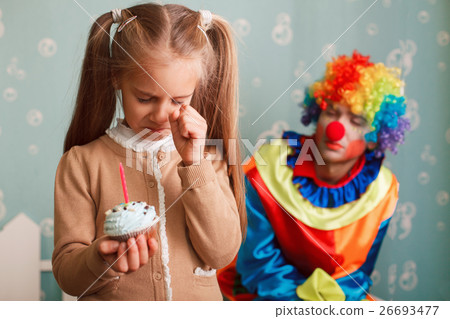 Girl holding a cake with candle in her hands. Girl holding a cake with candle in her hands. 26693477