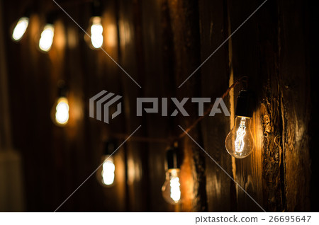Vintage incandescent Edison type bulbs on wooden 26695647
