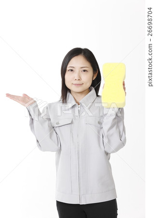 A young lady with a car wash sponge 26698704