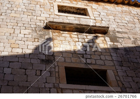 The shadow of a person standing up the staircase reflected in the castle wall of Dubrovnik old city The shadow of a person standing up the staircase reflected in the castle wall of Dubrovnik old city 26701766