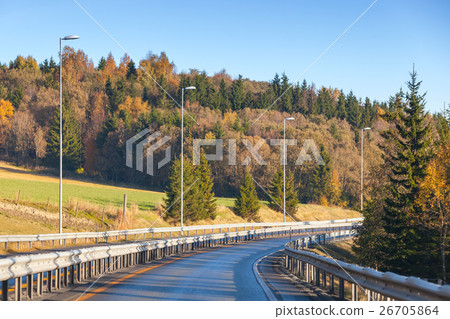 Turning rural Norwegian road in autumn 26705864
