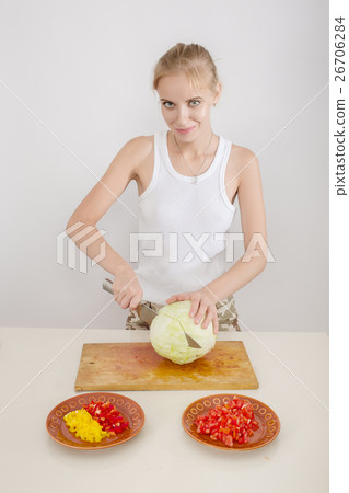 woman cutting cabbage woman cutting cabbage 26706284