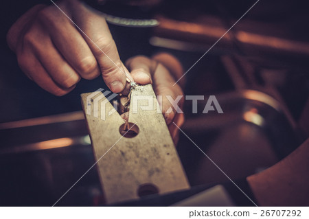 Jeweler at work in jewelery workshop Jeweler at work in jewelery workshop 26707292