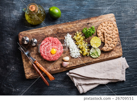 Beef tartare on cutting board Beef tartare on cutting board 26709551