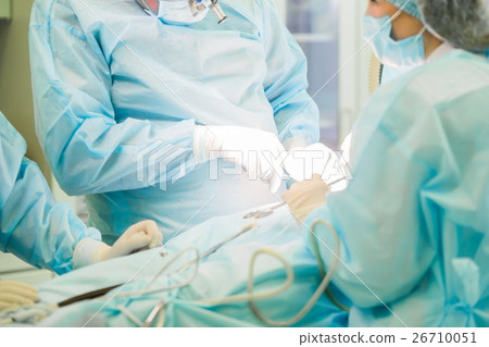 Surgeon performing cosmetic surgery 26710051