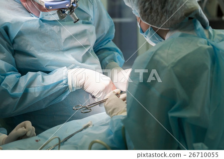 Surgeon performing nose reshaping. Rhinoplasty 26710055