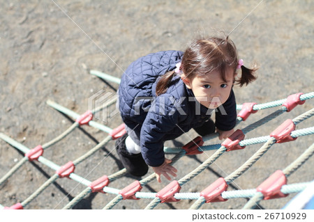 Infant playing with a tightrope (2 years old child) Infant playing with a tightrope (2 years old child) 26710929