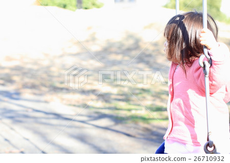 Infant playing with a swing (2 years old child) Infant playing with a swing (2 years old child) 26710932