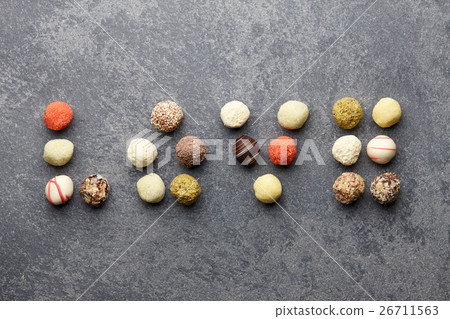 Truffle chocolates arranged in love Truffle chocolates arranged in love 26711563