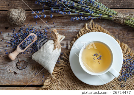 Bunch of lavender flowers, sachets and tea cup. 26714477
