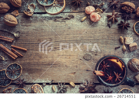 Mulled wine in mug with spices and ingredients  26714551
