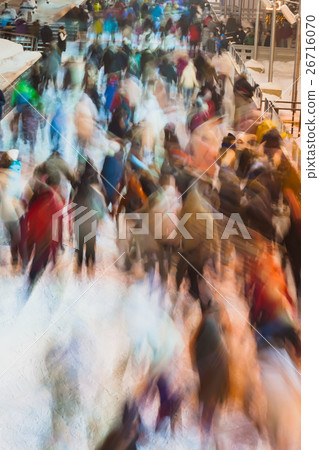 Blurred ice rink with families together in evening Blurred ice rink with families together in evening 26716070