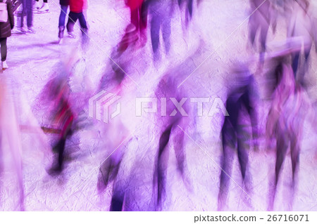 Blurred ice rink with people in evening time 26716071