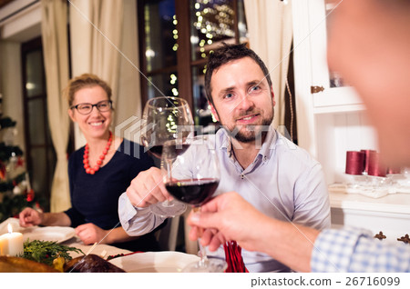 Beautiful couple celebrating Christmat together Beautiful couple celebrating Christmat together 26716099