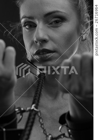 Woman in leather handcuffs Woman in leather handcuffs 26716964