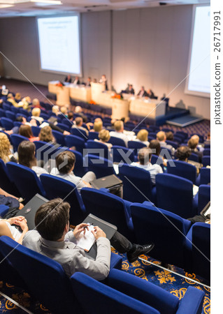 Audience in lecture hall on scientific conference. 26717991