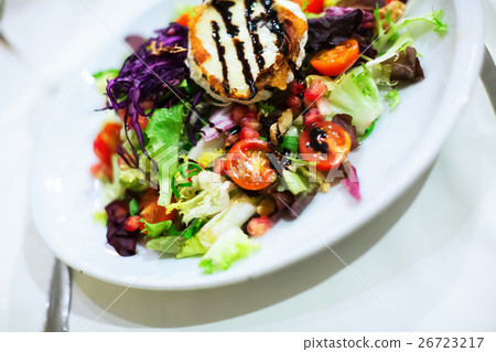 Spanish vegetable salad with dressing on white plate Spanish vegetable salad with dressing on white plate 26723217