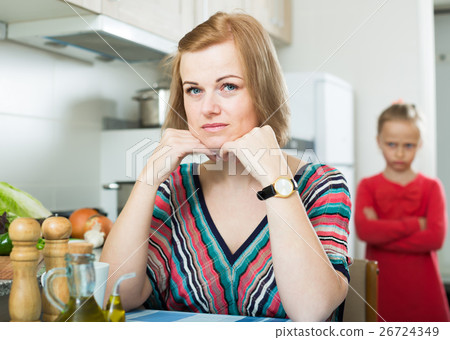 Adult frustrated mom scolding little daughter 26724349