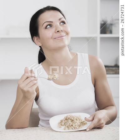 Girl eat porridge 26724731