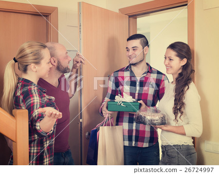 Family receiving visitors Family receiving visitors 26724997