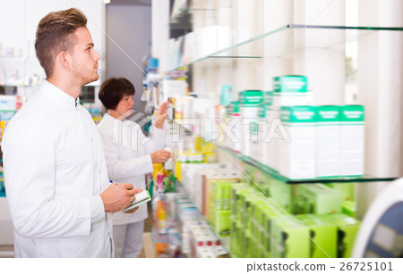 Portrait of two laughing adult pharmacists Portrait of two laughing adult pharmacists 26725101