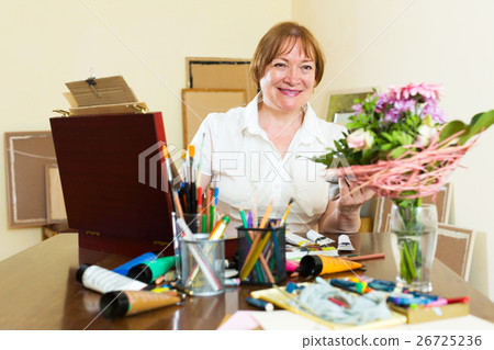 senior woman painting picture 26725236